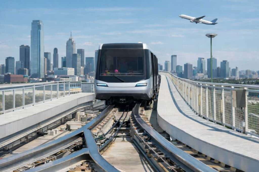 Automated people mover guideway and switching infrastructure at airport terminal
